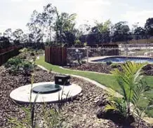 Septic tank cover in landscaped backyard garden