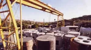 Steel coils stacked in industrial yard