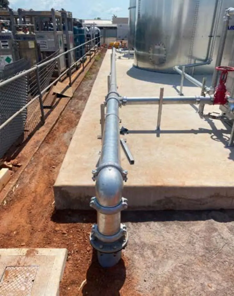 Industrial pipeline and storage tank on concrete platform