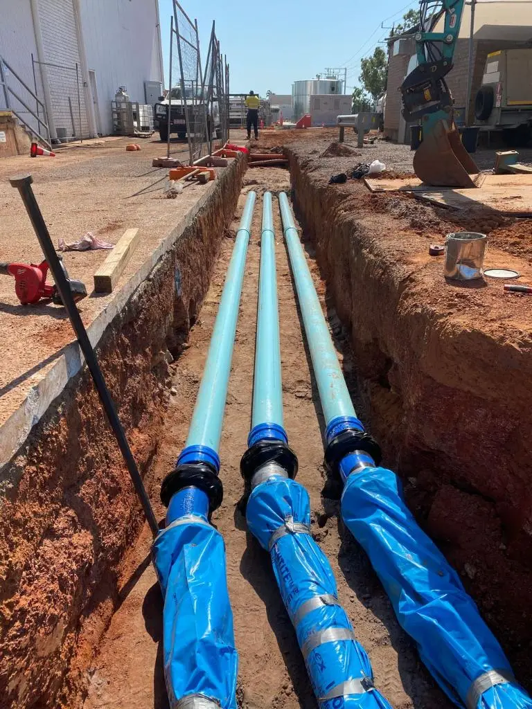 Underground pipes installed in construction trench