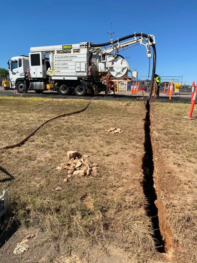 Hydro excavation truck digging trench on construction site