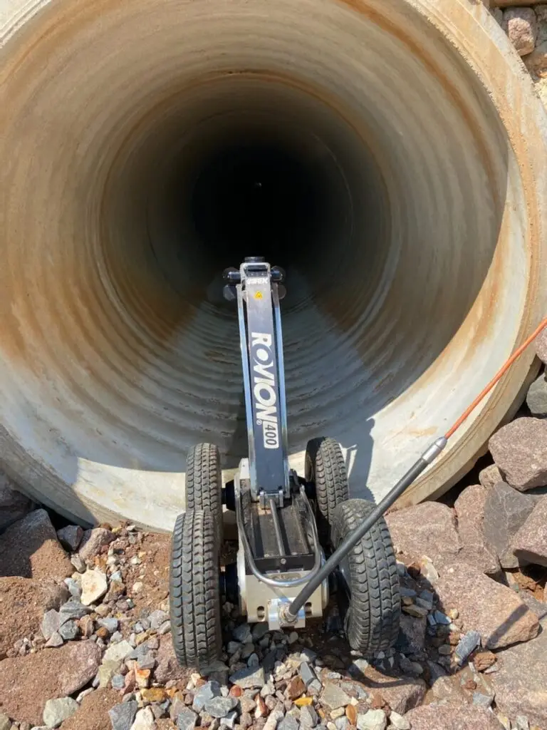 Inspection robot entering large concrete drainage pipe
